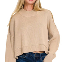 Light mocha oversized cropped sweater with ribbed high neckline and side slits