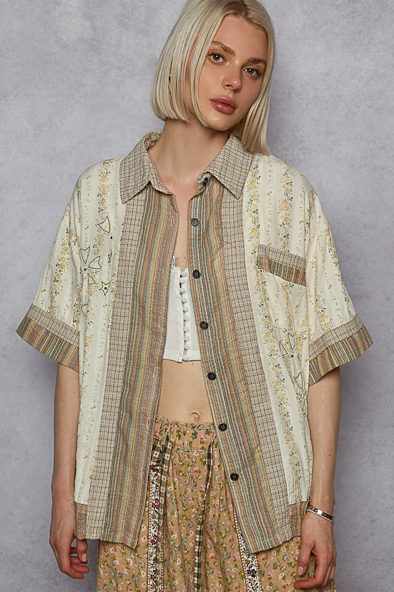 Cream patchwork short-sleeve button-down shirt with pointed collar and dark buttons