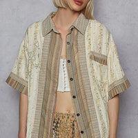Cream patchwork short-sleeve button-down shirt with pointed collar and dark buttons