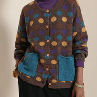 Plus-size dark brown polka-dot button cardigan with two blue patch pockets and ribbed cuffs