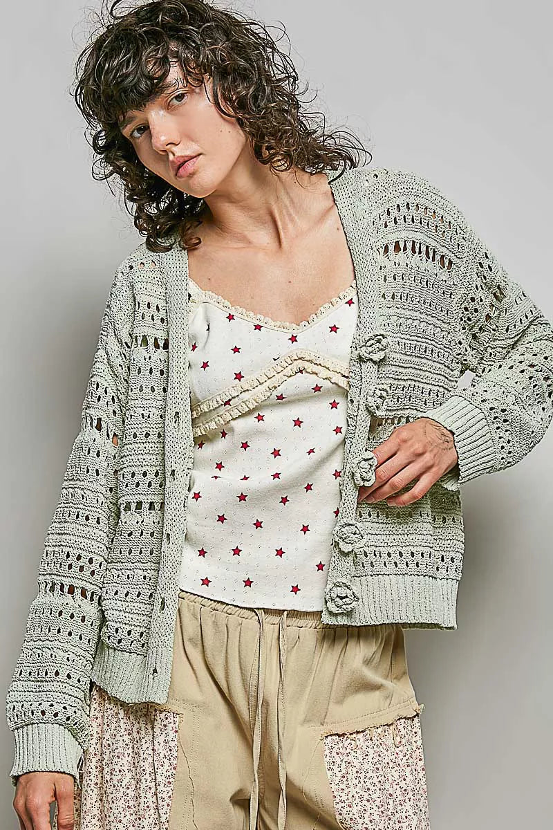 Light gray open-knit cardigan, button-front with rose-like appliques and long sleeves