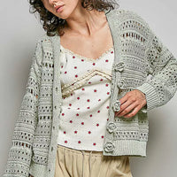 Light gray open-knit cardigan, button-front with rose-like appliques and long sleeves