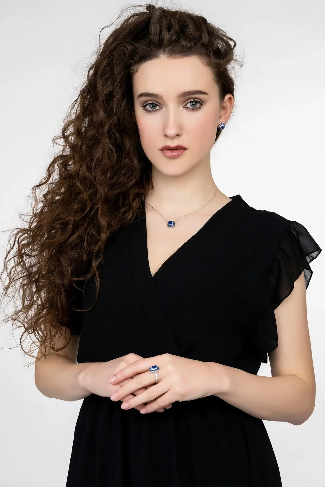 Sapphire pendant necklace on silver chain, blue square pendant at collar
