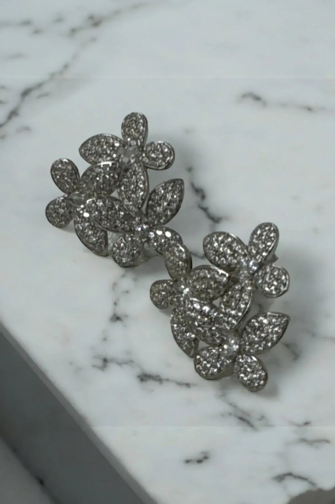 Silver glitter flower cluster stud earrings, front view close-up