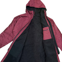 Plum changing robe opened to show black fleece lining, hood and inner pocket