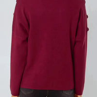 Wine red high-neck jumper back view with shoulder button accents and long sleeves