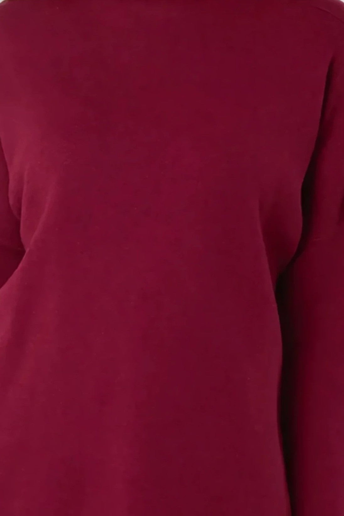 Wine red knit jumper fabric close-up