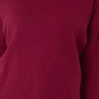 Wine red knit jumper fabric close-up