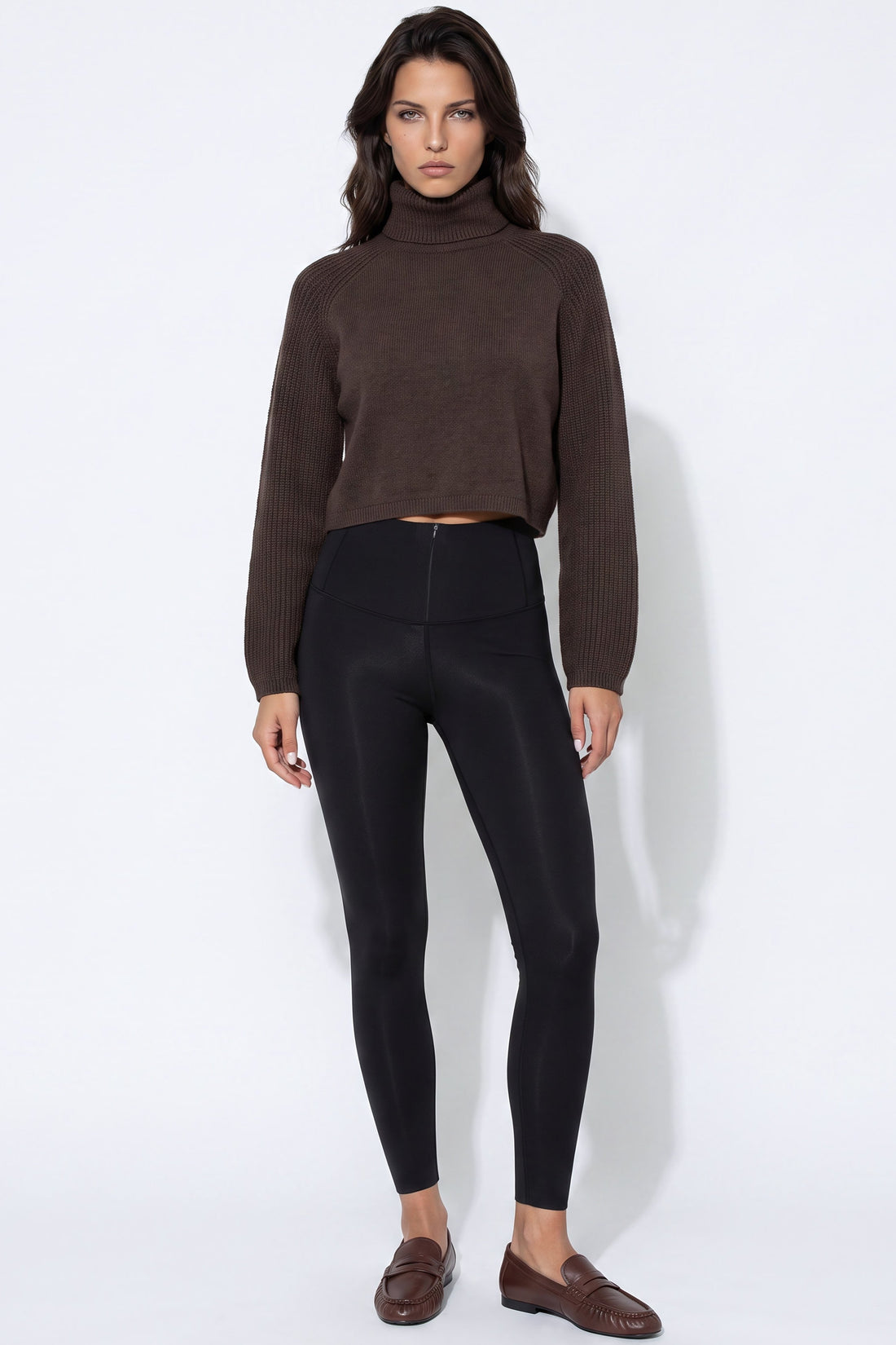 Black leggings with wide waistband and smooth front seams.