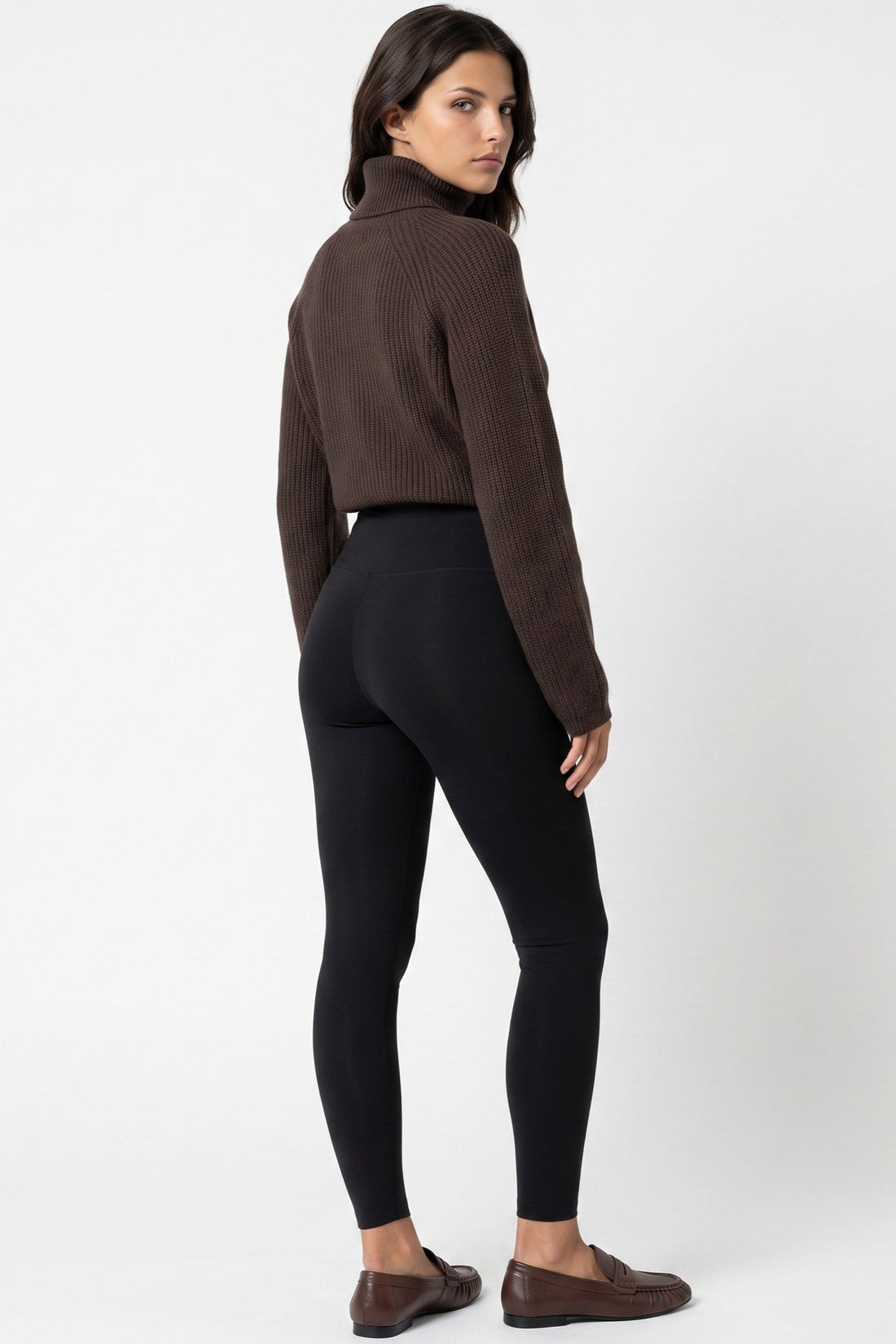 Black leggings with wide waistband, fitted ankle length.