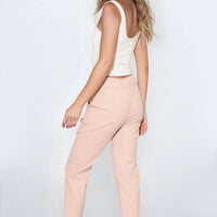 Dusty pink stretch drawstring trousers with side pockets, relaxed straight leg