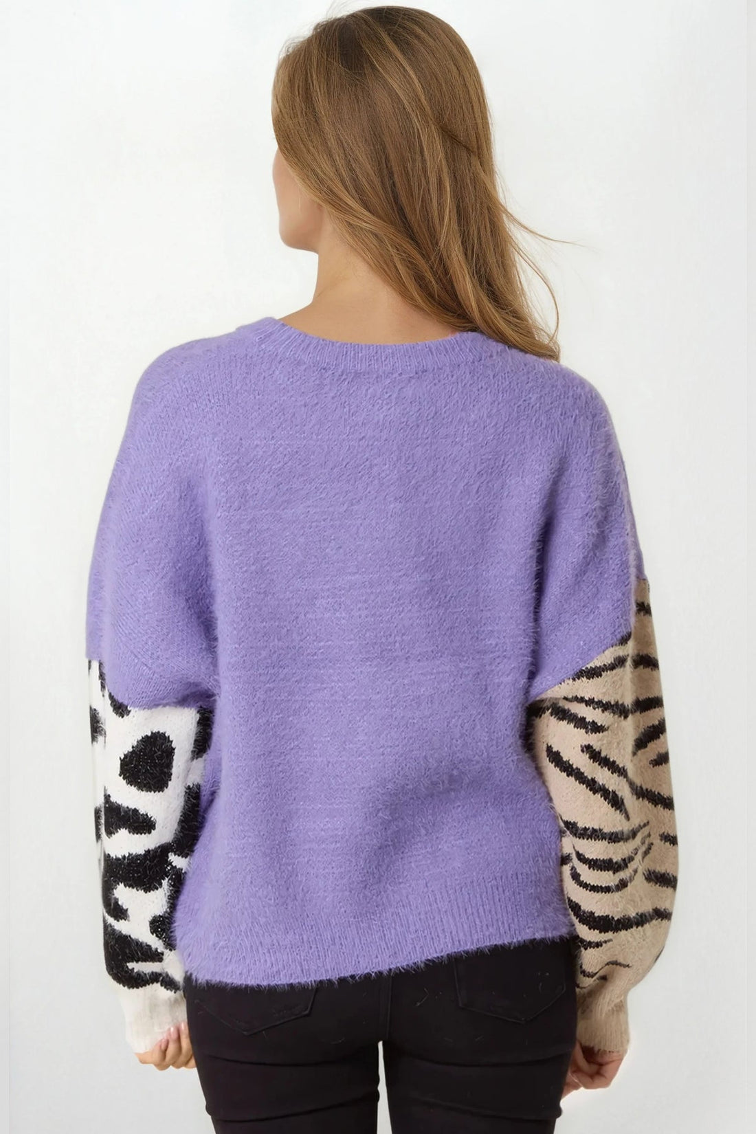Back view of purple knit jumper with zebra-striped sleeve panels and crew neckline