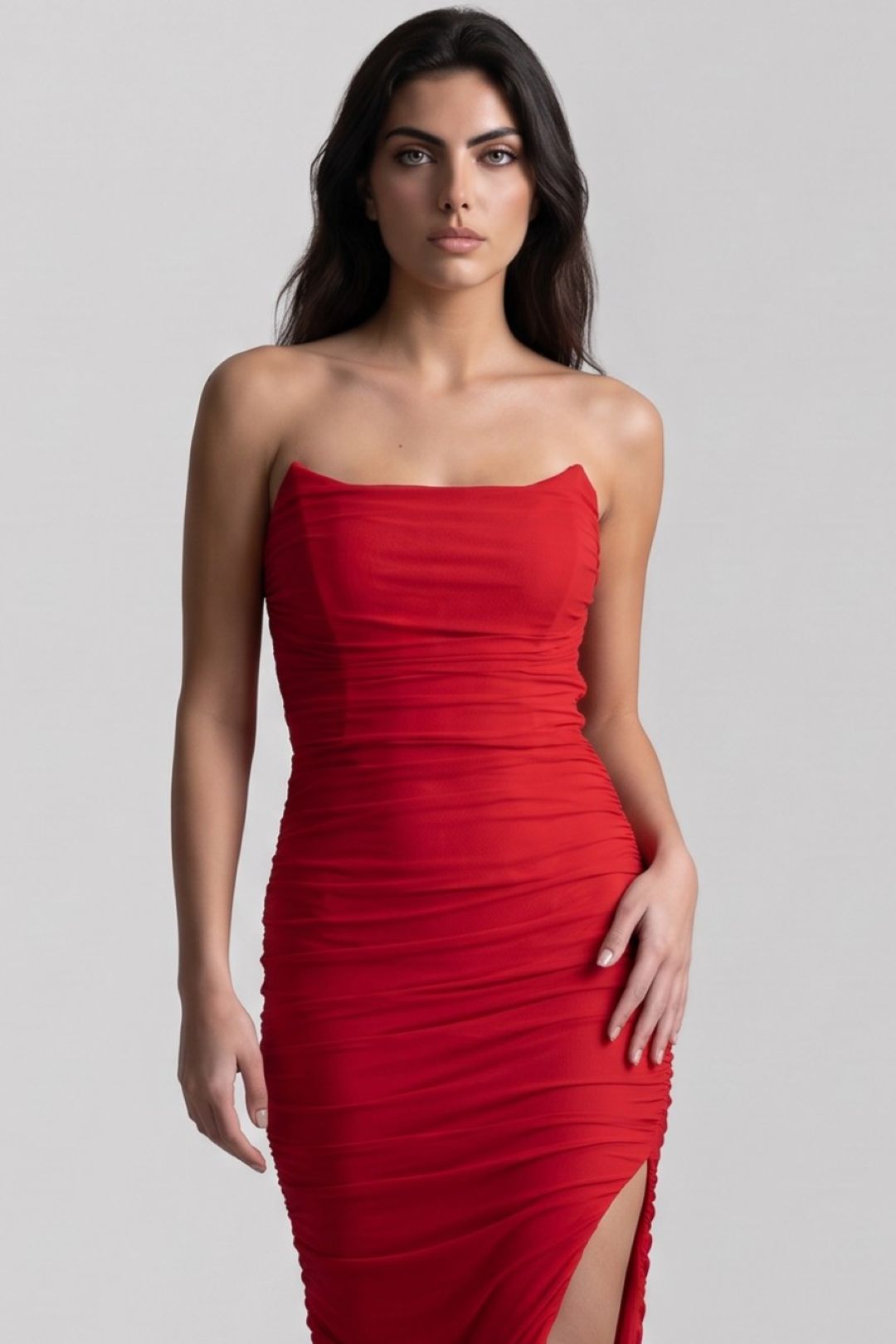 Red strapless ruched maxi dress with side slit detail, fitted sleeveless silhouette