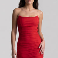 Red strapless ruched maxi dress with side slit detail, fitted sleeveless silhouette