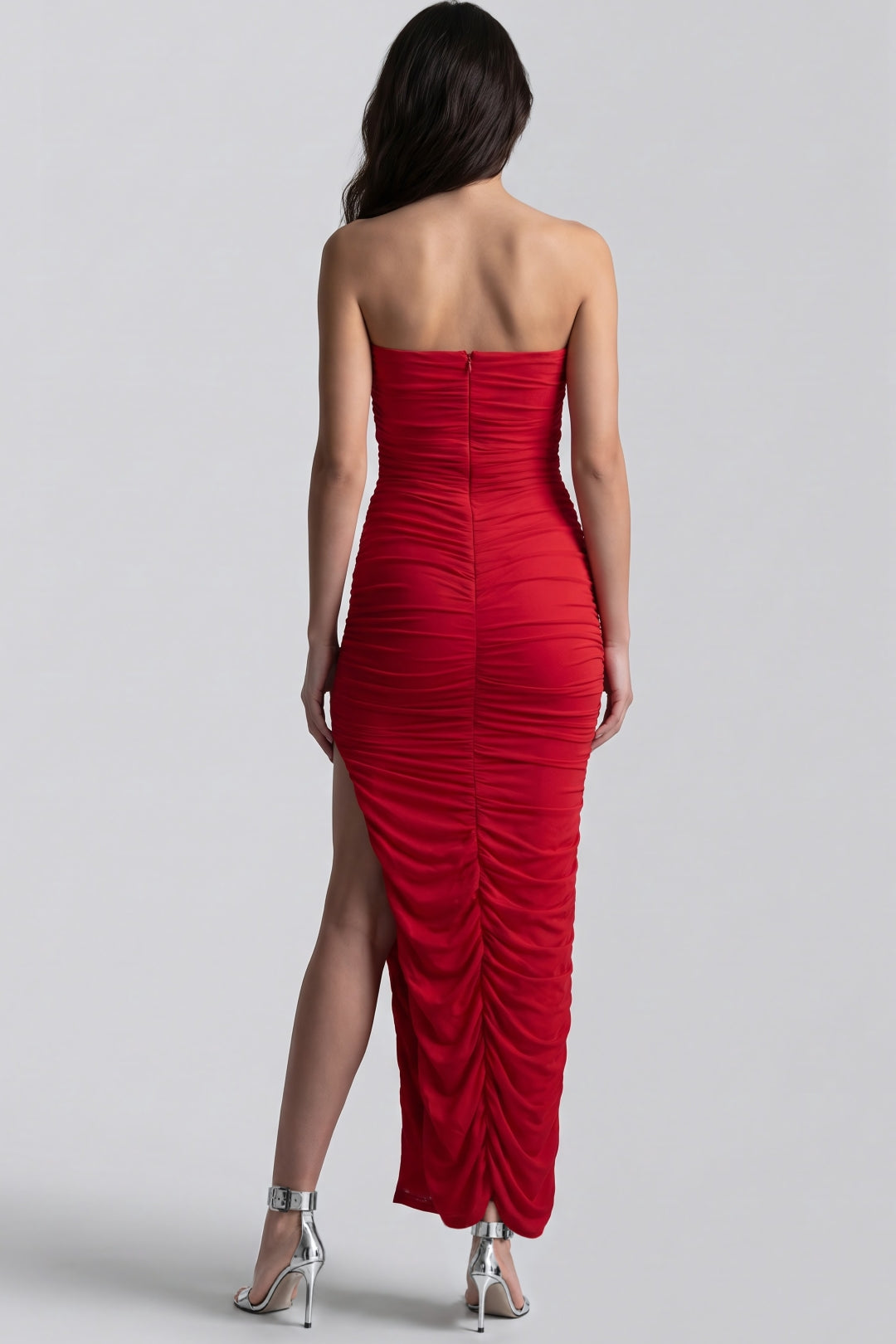 Red strapless ruched maxi dress back view, gathered fabric and high slit