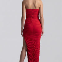 Red strapless ruched maxi dress back view, gathered fabric and high slit