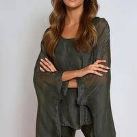 Charcoal silk blouse with round neck and batwing sleeves, draped front