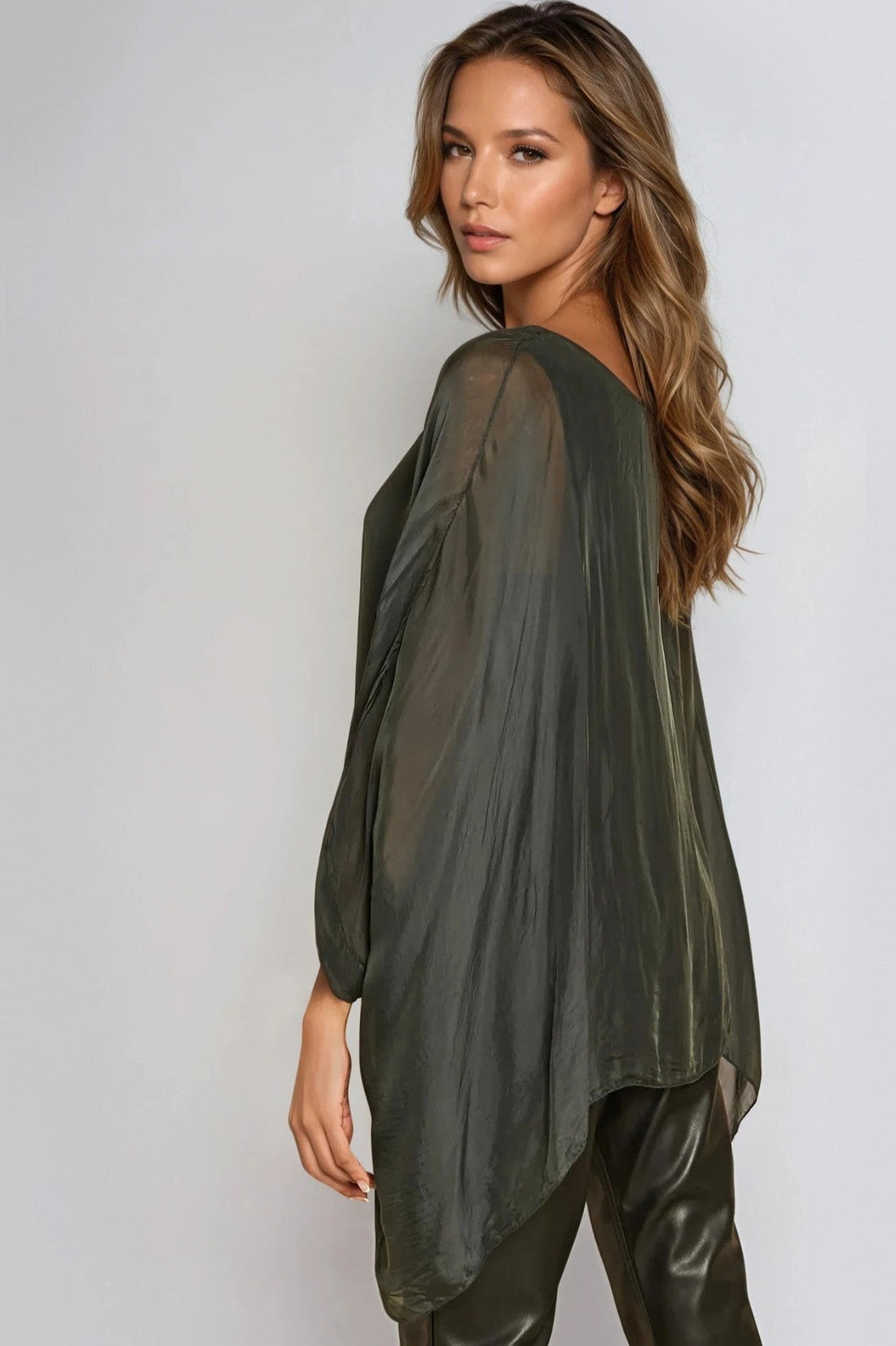 Charcoal silk blouse side view with batwing sleeves and draped silhouette