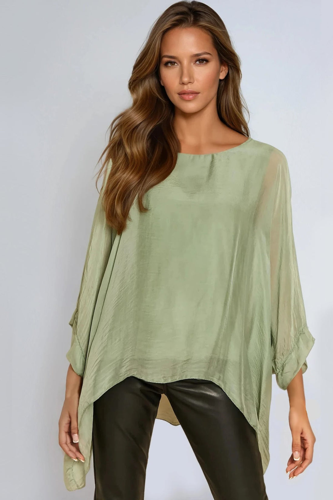 Light green silk blouse with batwing sleeves and round neckline