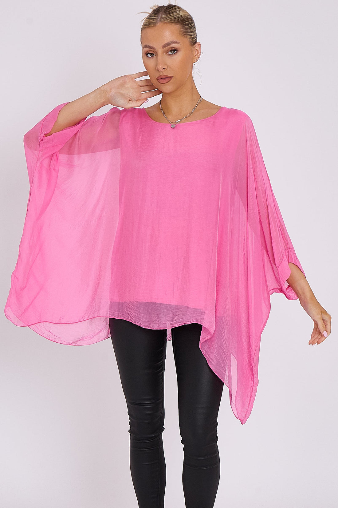 Pink silk batwing-sleeve top with rounded neckline, fluttery sleeve drape
