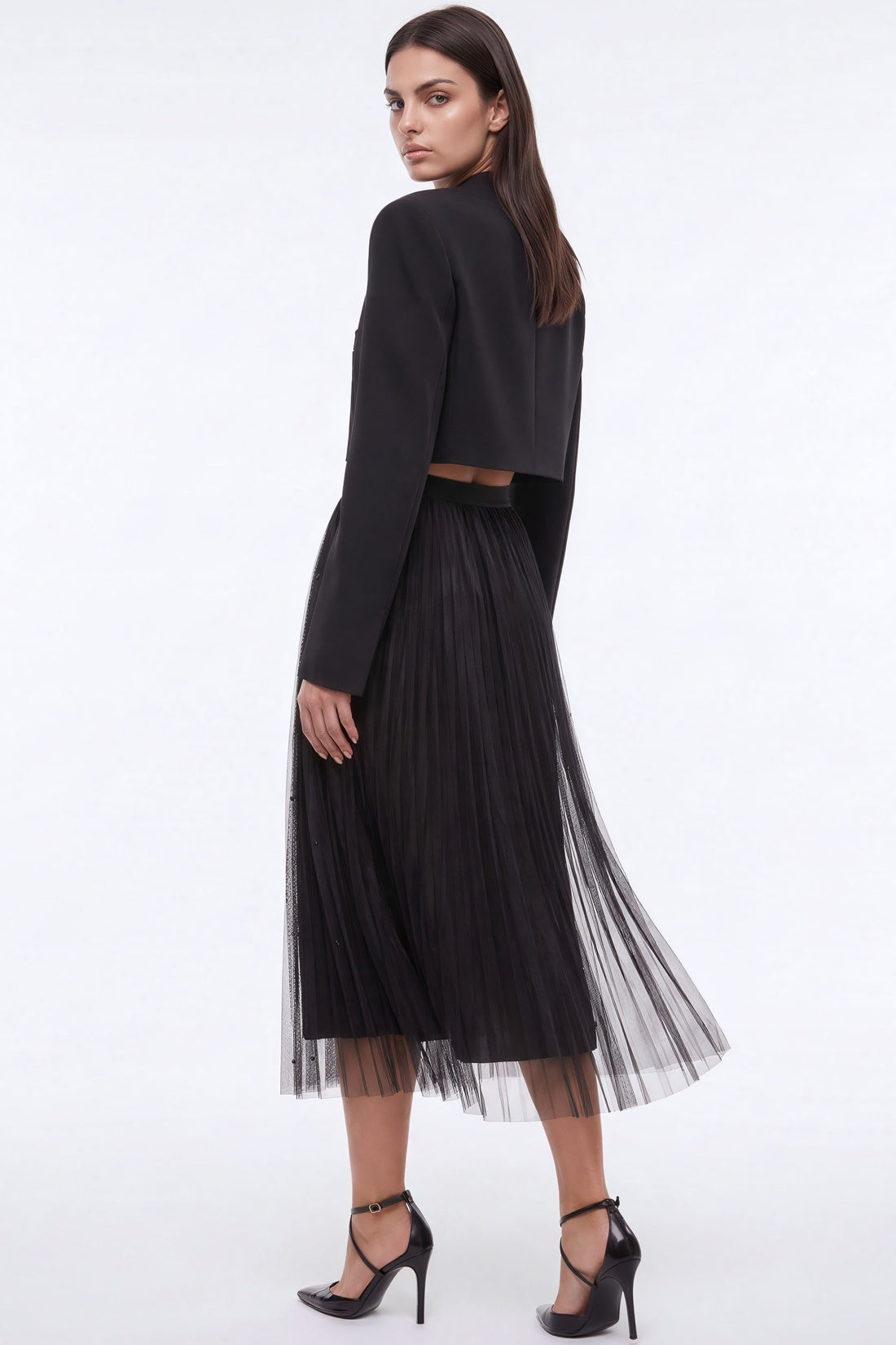Black mesh midi skirt with faux pearl embellishments, pleated silhouette and sheer overlay