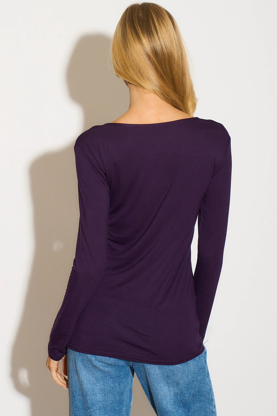 Purple long-sleeve round-neck top, back view with draped fit and full-length sleeves