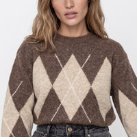 Brown crew-neck argyle jumper with large beige diamonds and zigzag lines, long sleeves