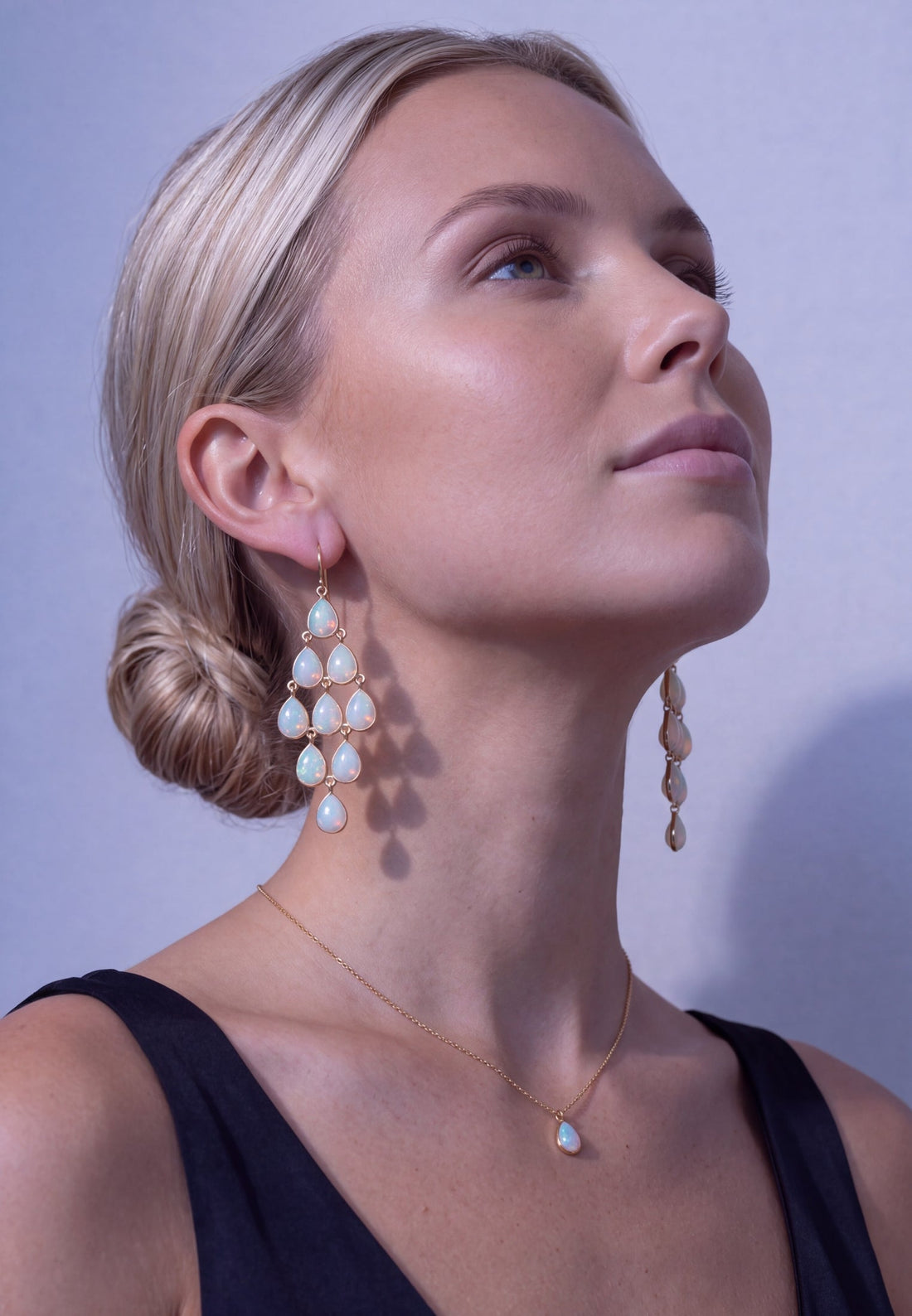 Gold-tone opal teardrop chandelier earrings, dangling multi-drop design