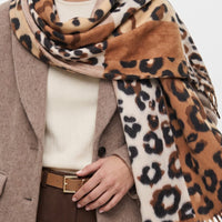 Brown and cream spotted scarf with wide panels and long tassel fringe, draped