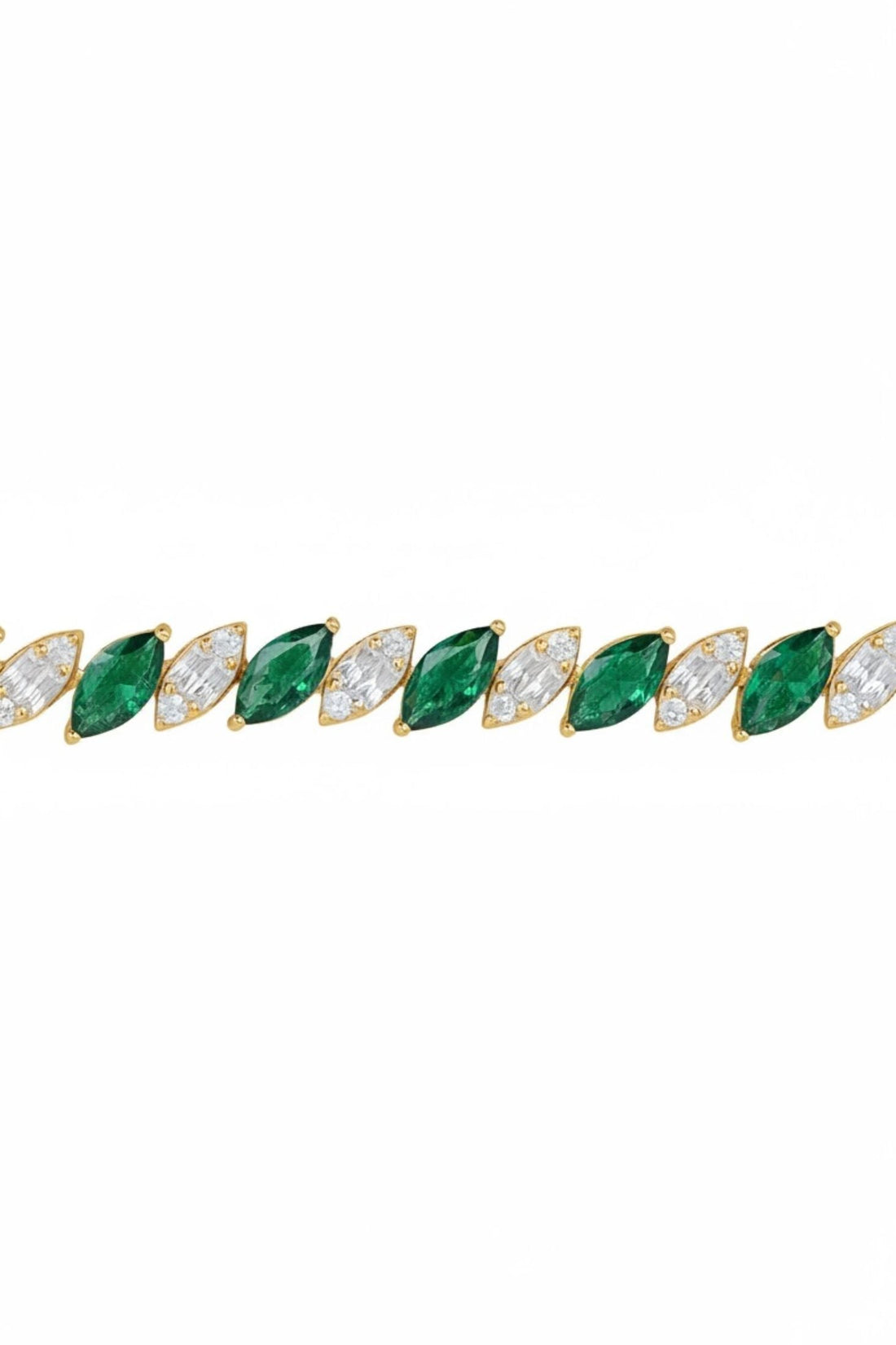 Tennis bracelet close-up with emerald-green oval stones and clear accents