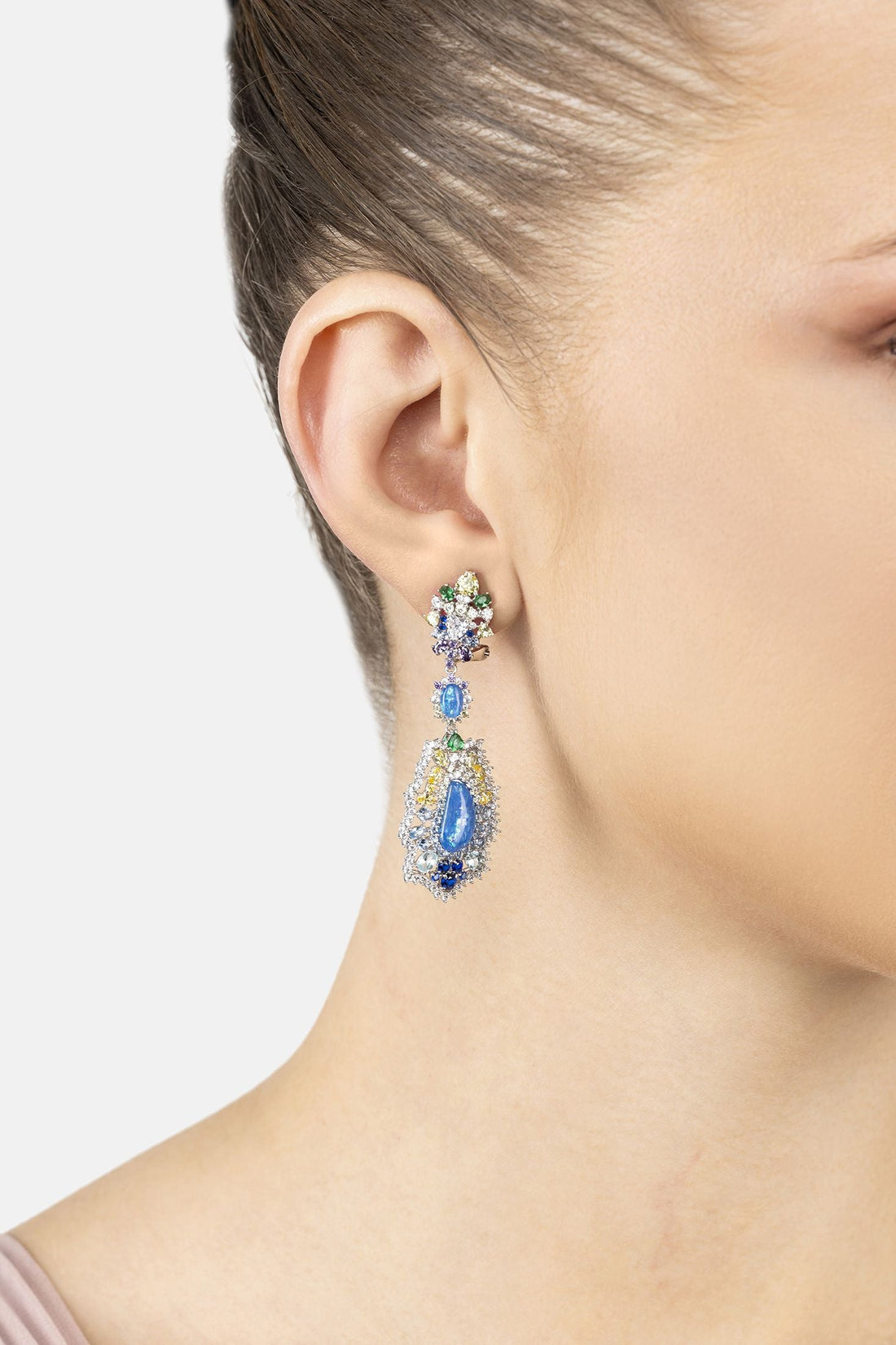 Multicolor gemstone drop earrings in silver, worn on ear