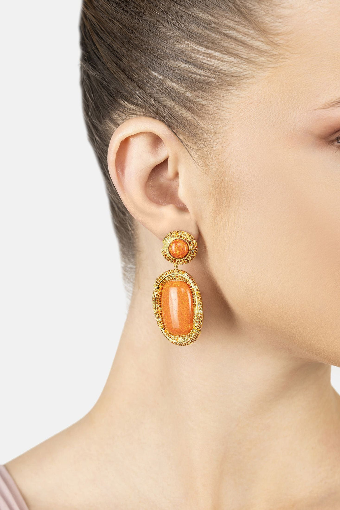 Gold drop earrings with round orange cabochon and dangling oval orange stone