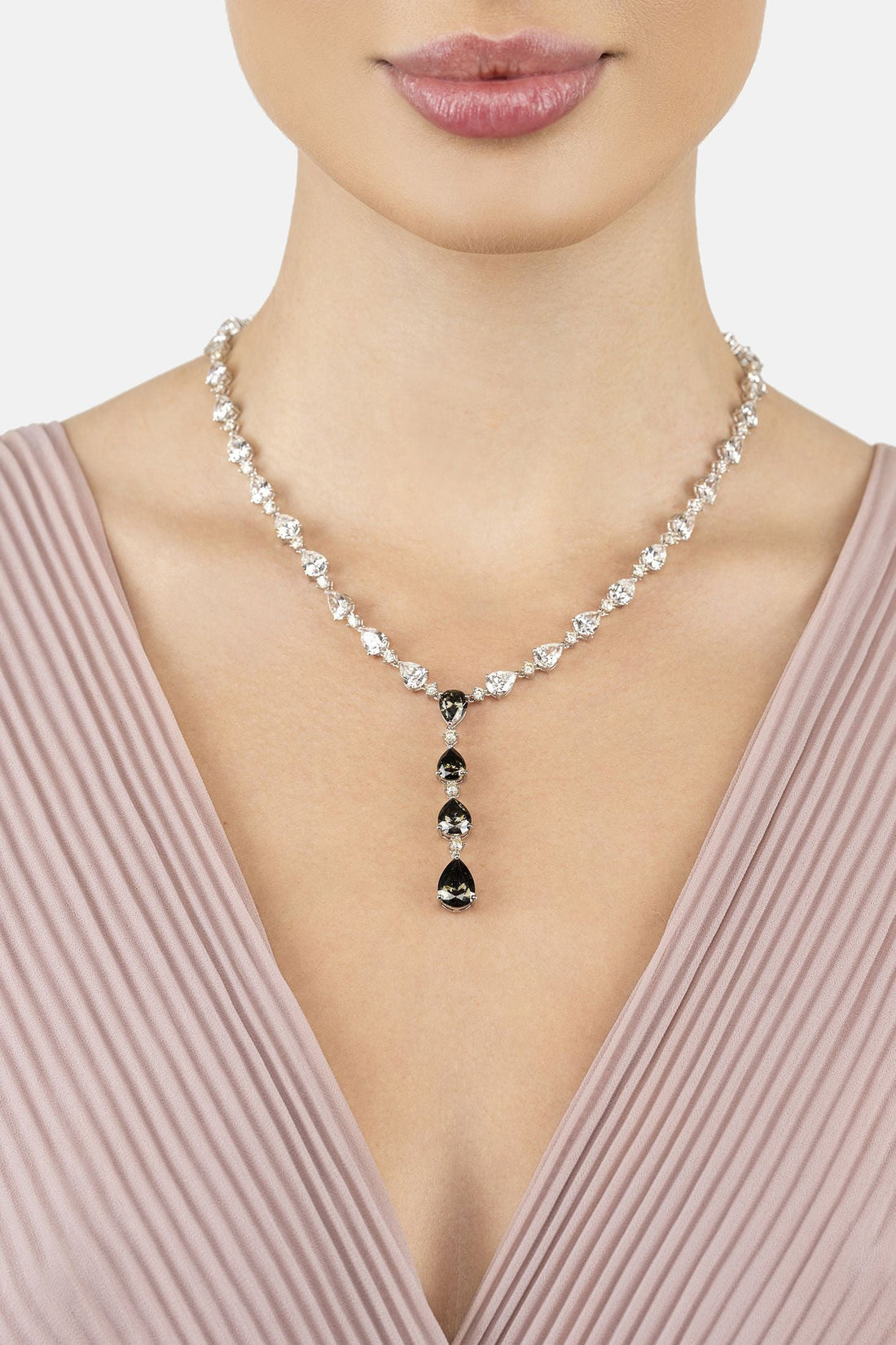 Silver crystal statement necklace with dark teardrop stones at the neckline
