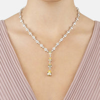Silver necklace with clear crystal links and yellow topaz drop center