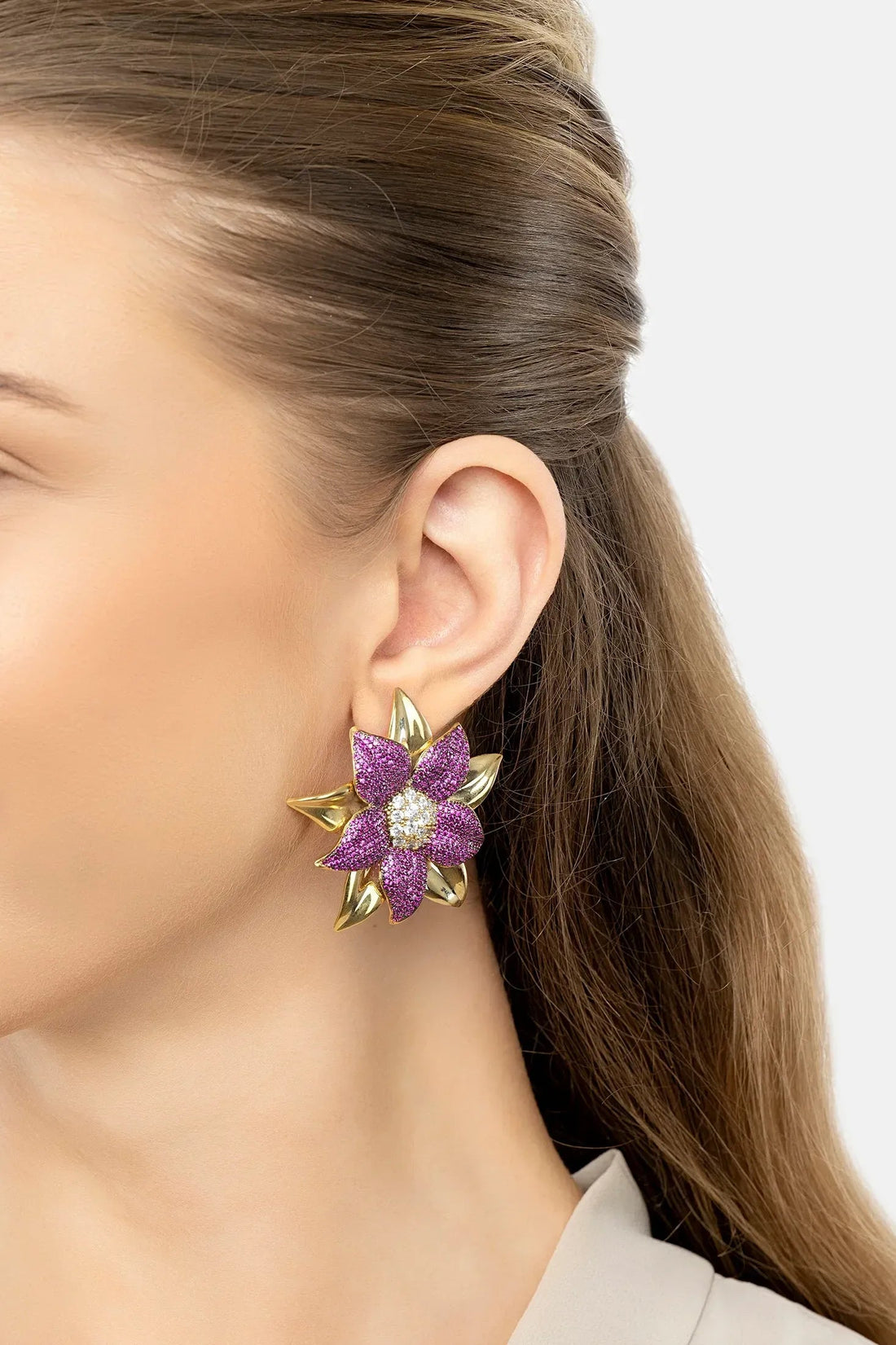 Gold-tone purple daisy stud earrings with white crystal center
