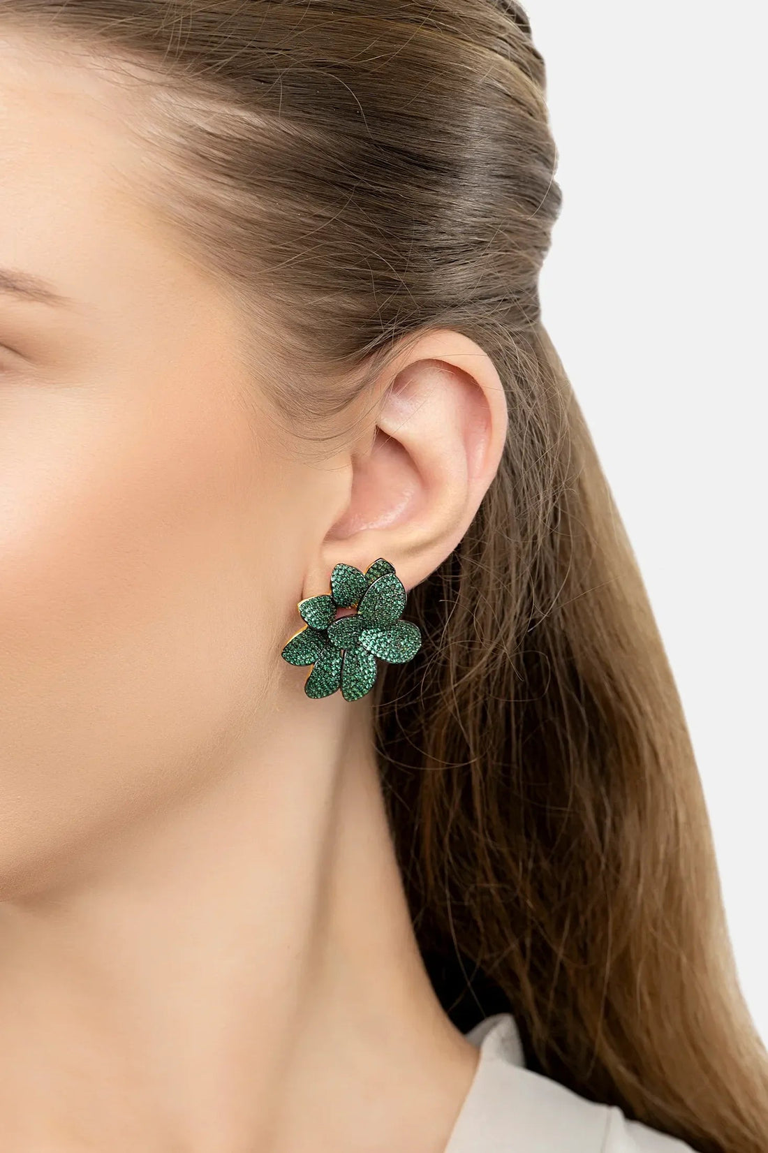 Emerald-green flower stud earrings with textured petals and gold-tone posts