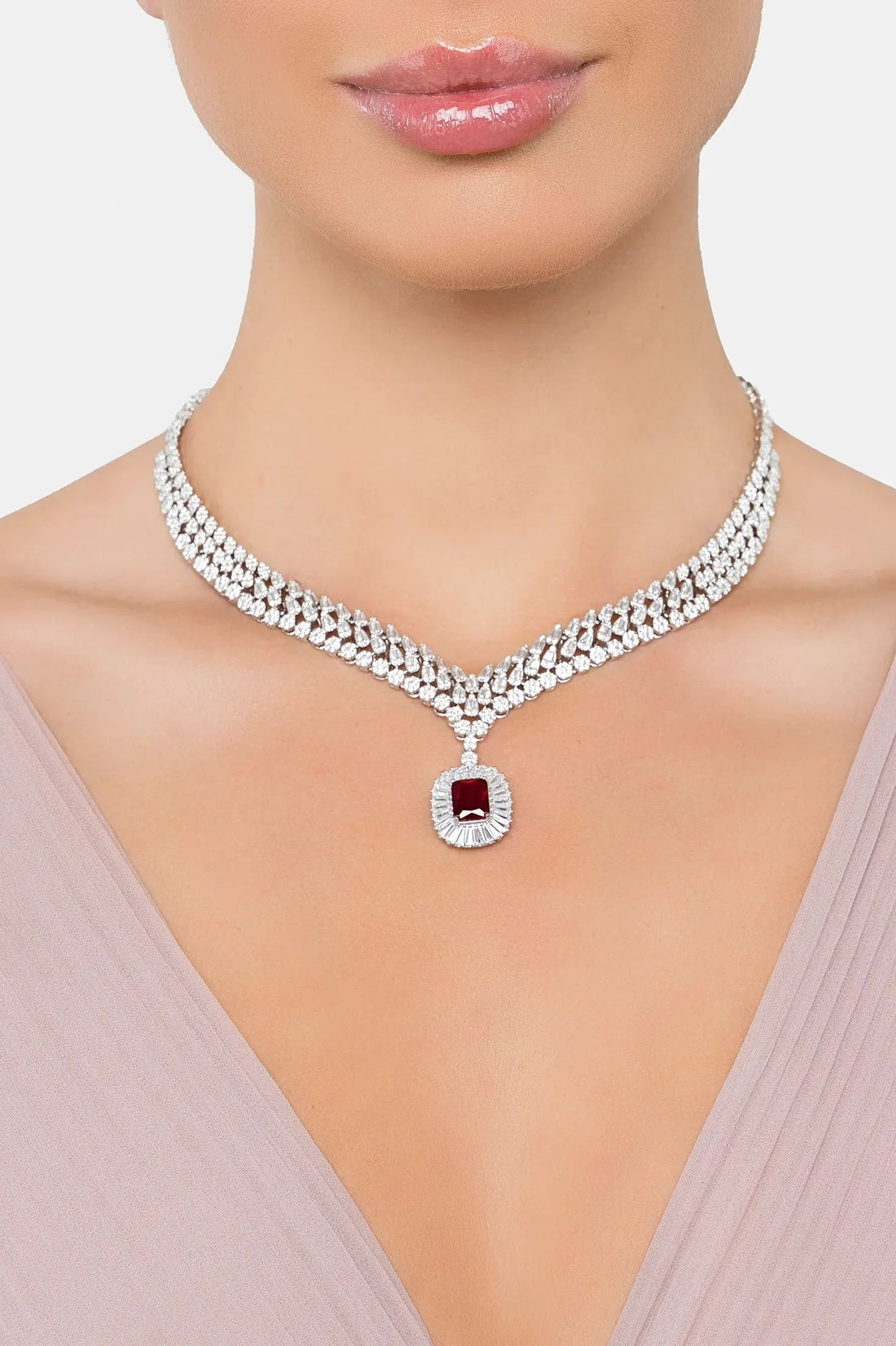 Silver rhinestone statement necklace with ruby-red pendant charm at center