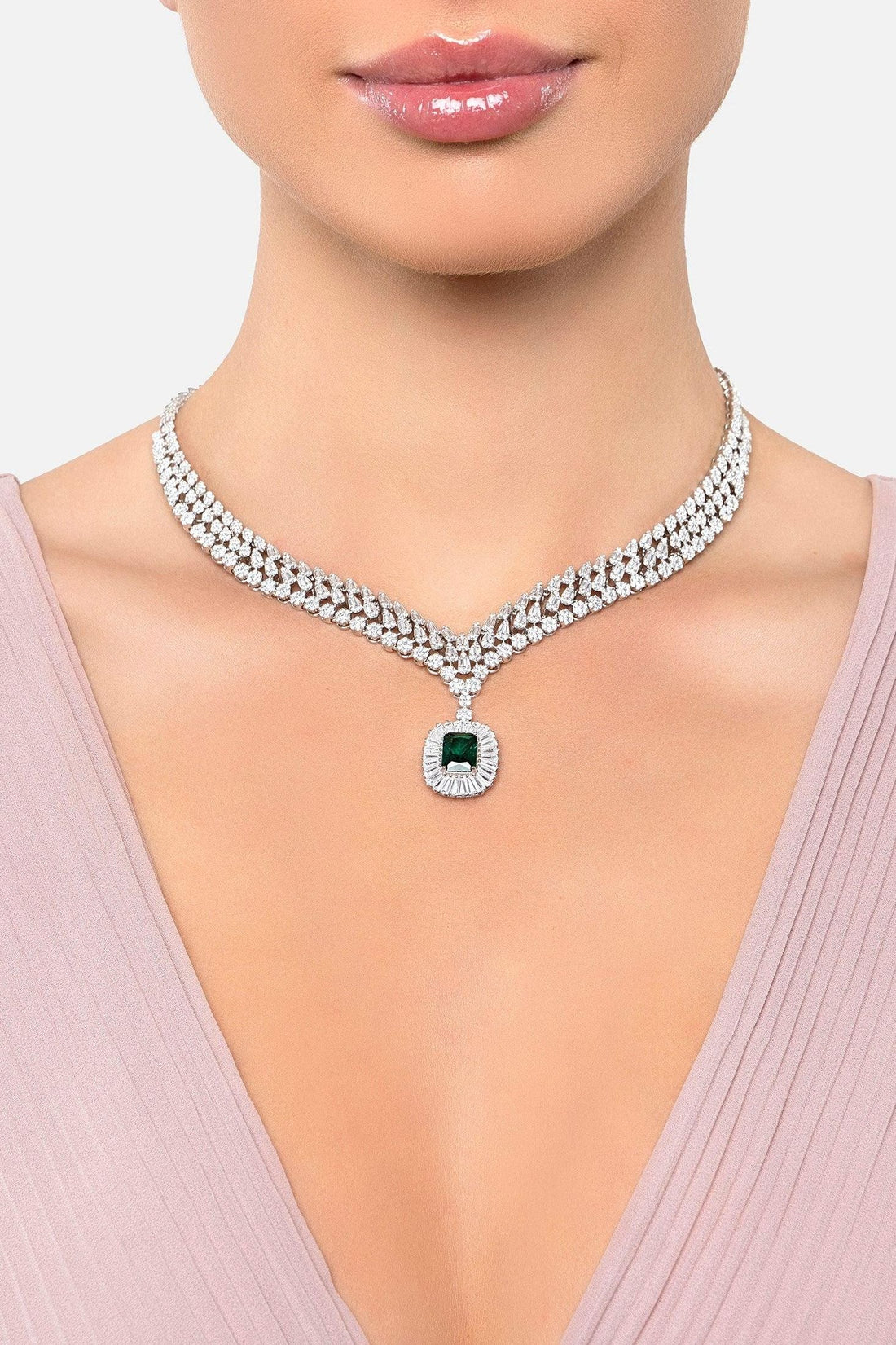 Silver rhinestone choker necklace with emerald center pendant and round emblem charm
