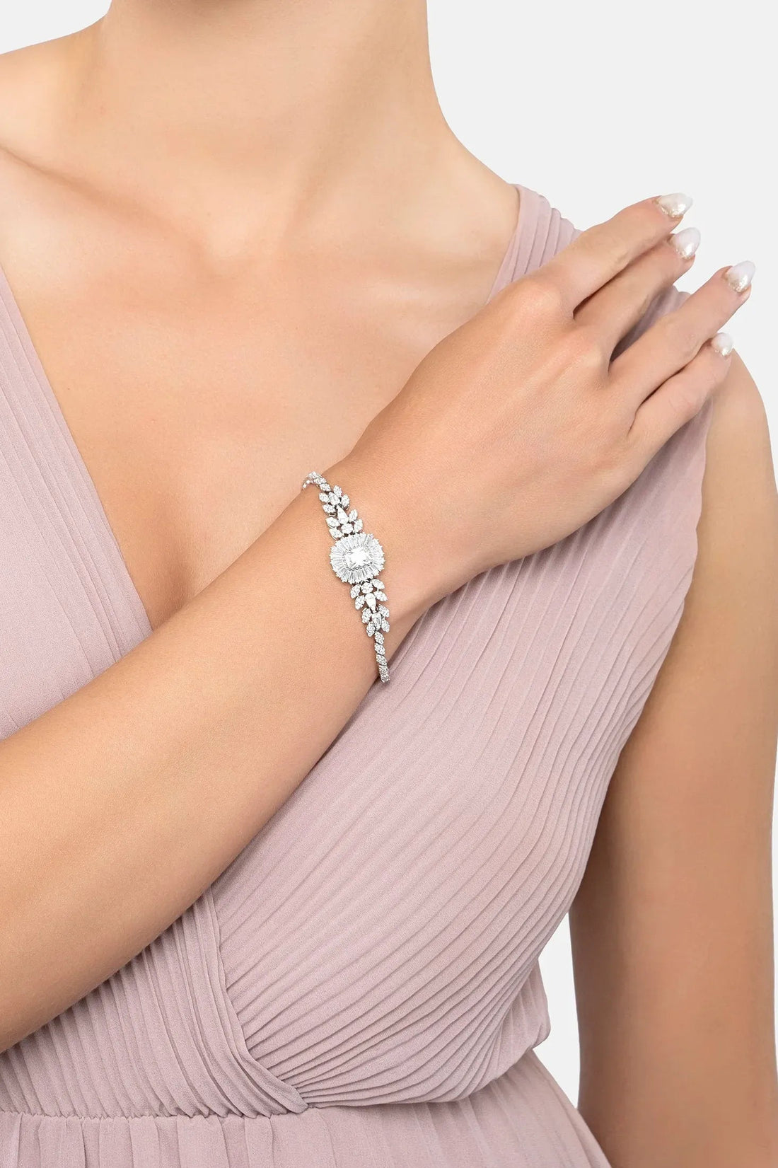 Silver gemstone bracelet on wrist with marquise links and central radiant-cut stone