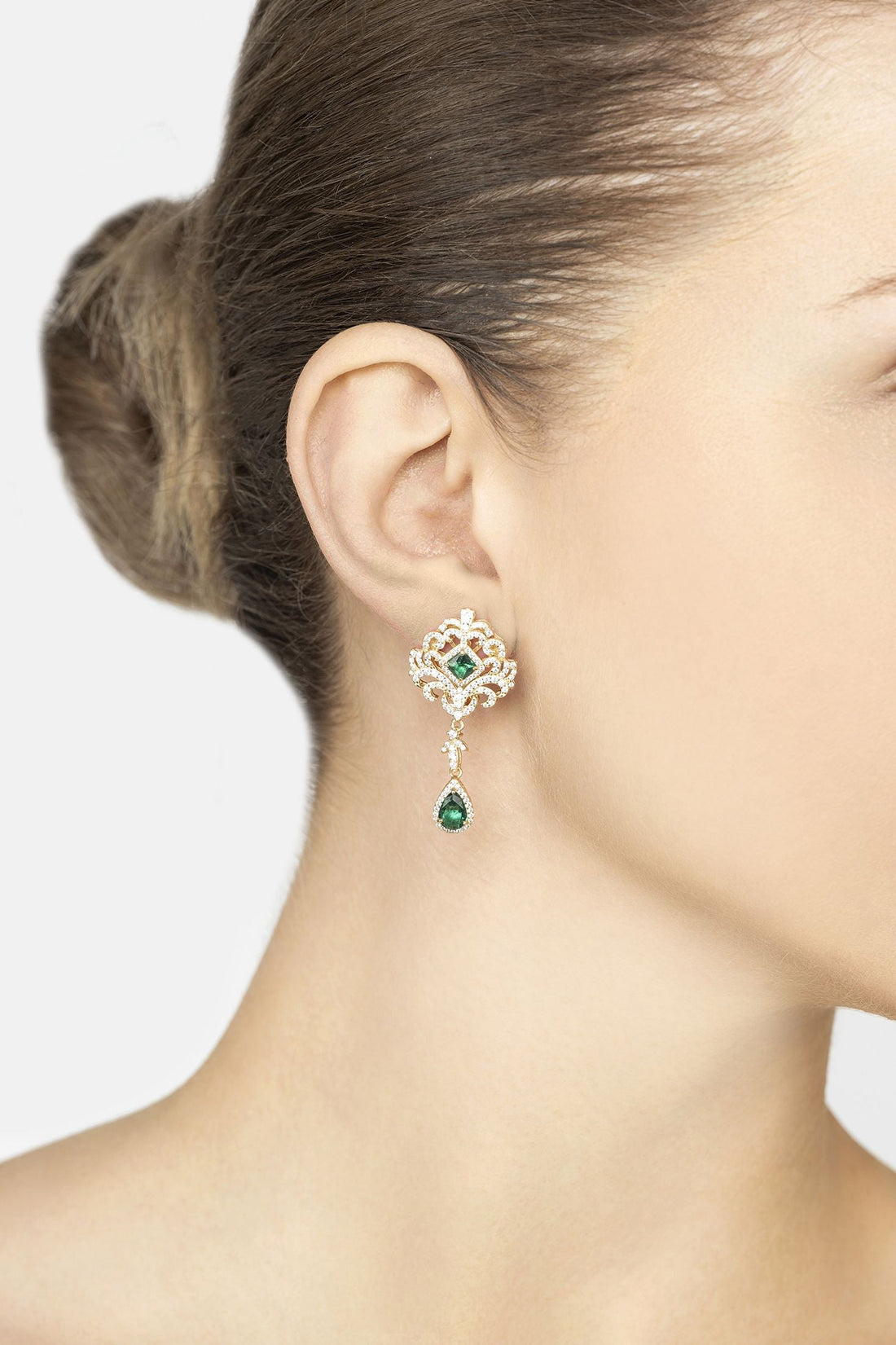 Gold drop earrings on model&