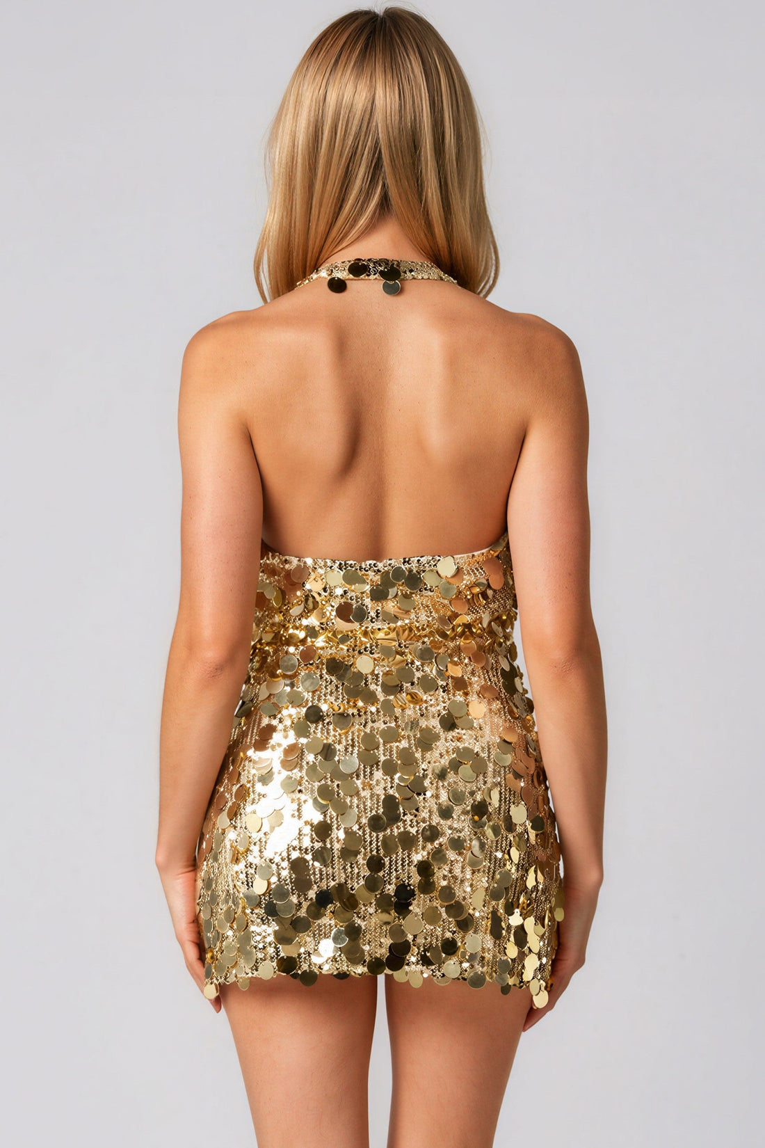 Gold sequin halter mini dress back view, open-back strap detail