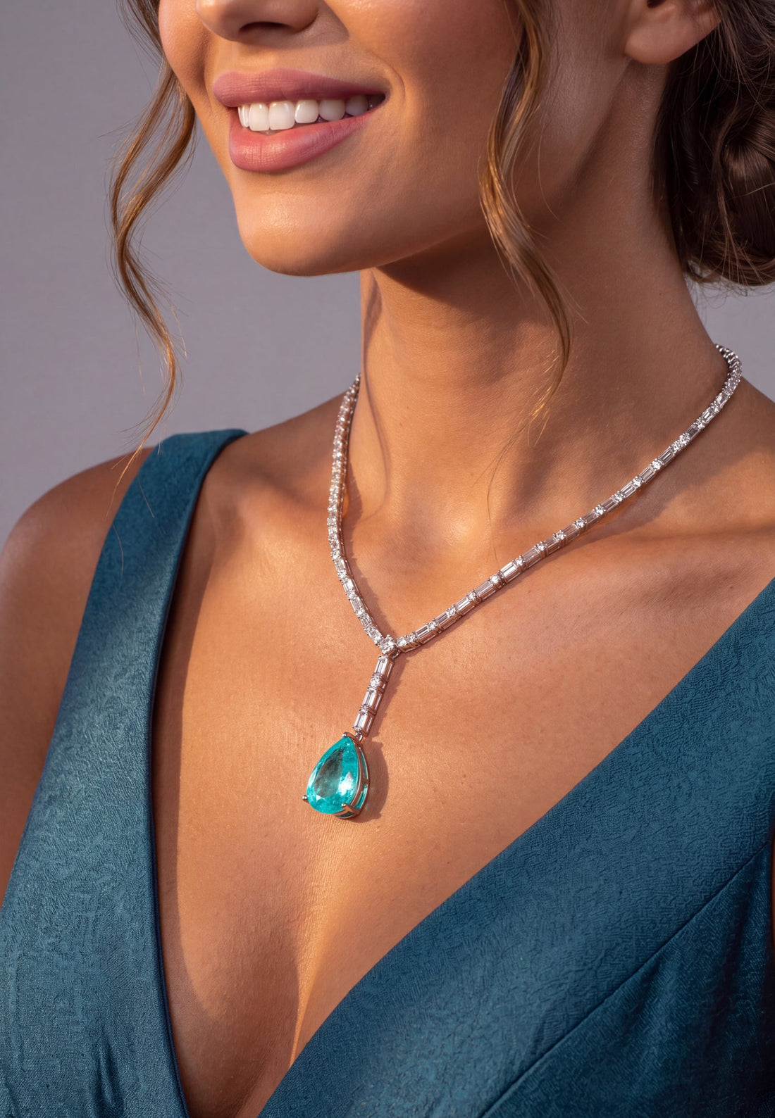 Silver necklace with turquoise teardrop pendant and crystal detailing