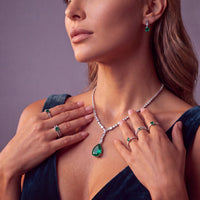 Sterling silver necklace with emerald teardrop pendant and crystal station link design
