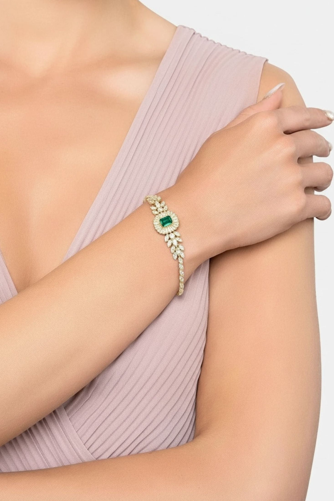 Countess gemstone bracelet with emerald center and gold-tone stones