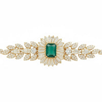 Gold-tone bracelet with emerald green square center gem and leaf crystal motifs