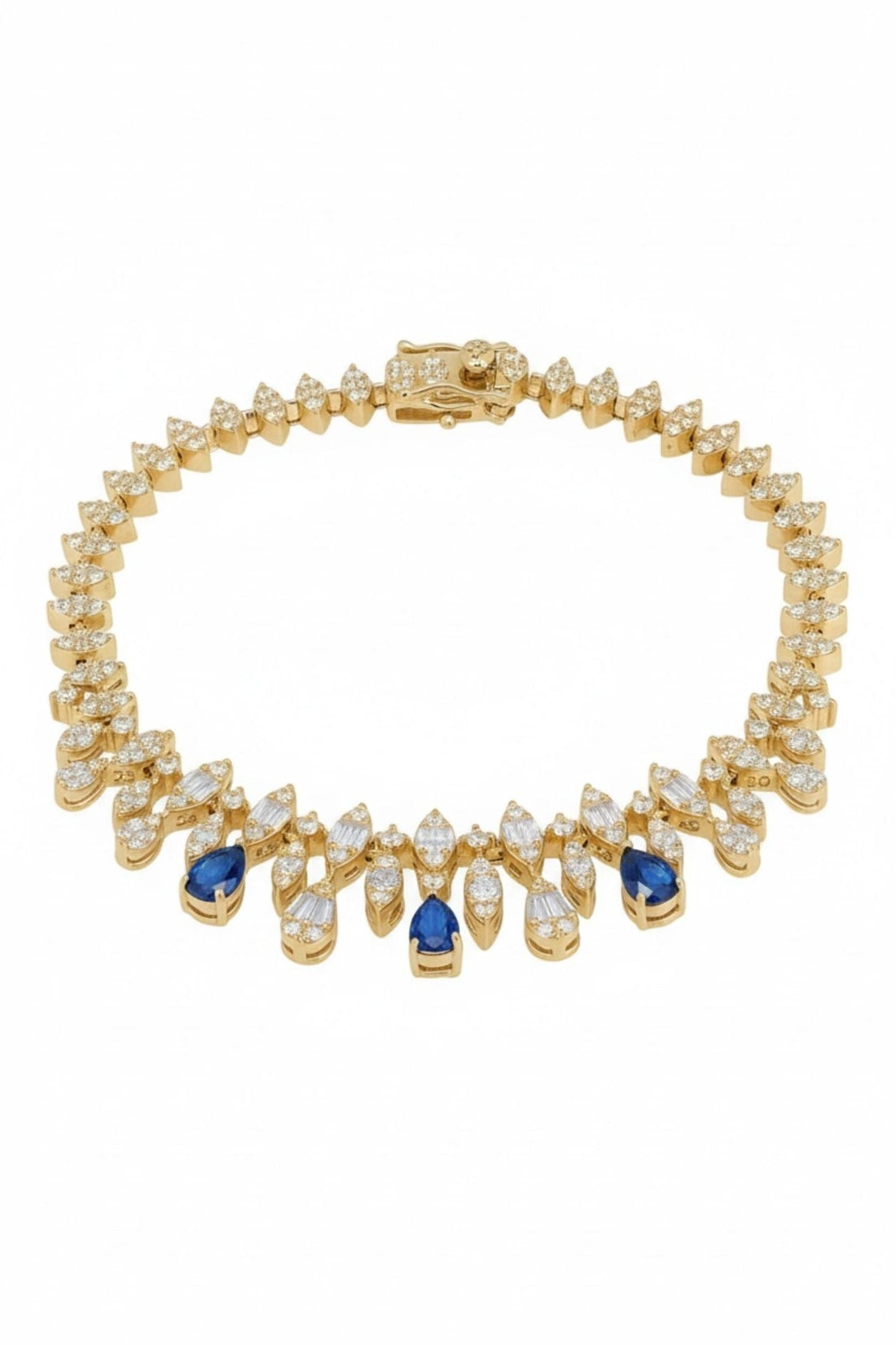 Gold tennis bracelet with clear stones and blue sapphire accents
