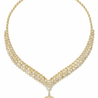 Gold-tone statement necklace with emerald drop pendant and rhinestone mesh chain