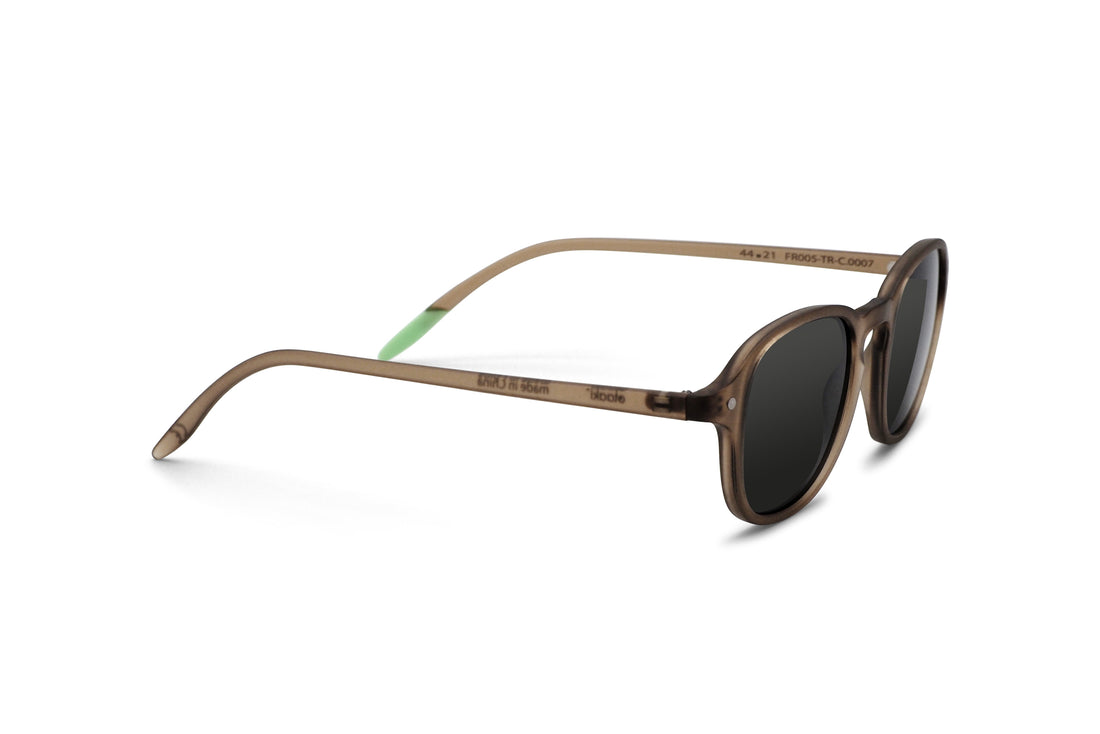 Brown round sunglasses, angled side view, dark lenses with green temple accents