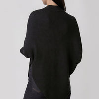 Black high-neck batwing knit jumper, angled asymmetric back hem