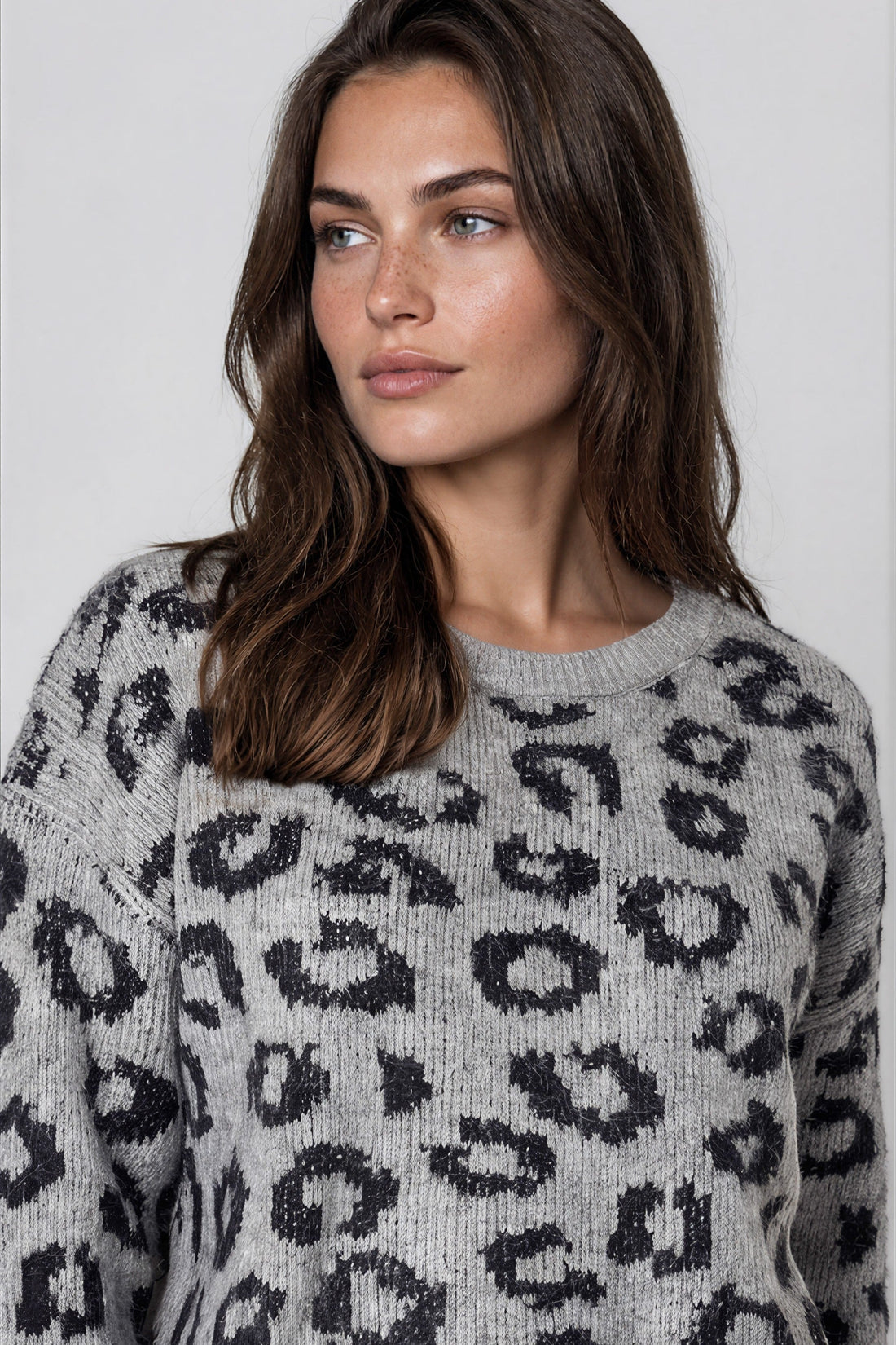 Grey leopard-print wool-blend jumper with round neck, close-up knit texture